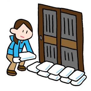 土のうを積む人
